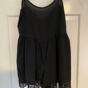 Black romper with lace at the bottom